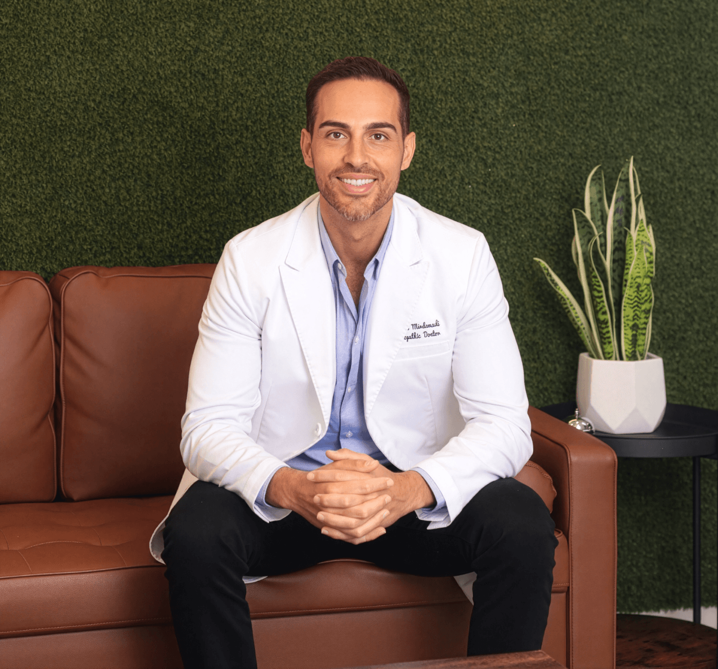 Dr. Pedi seated at Oasis Health & Medicine